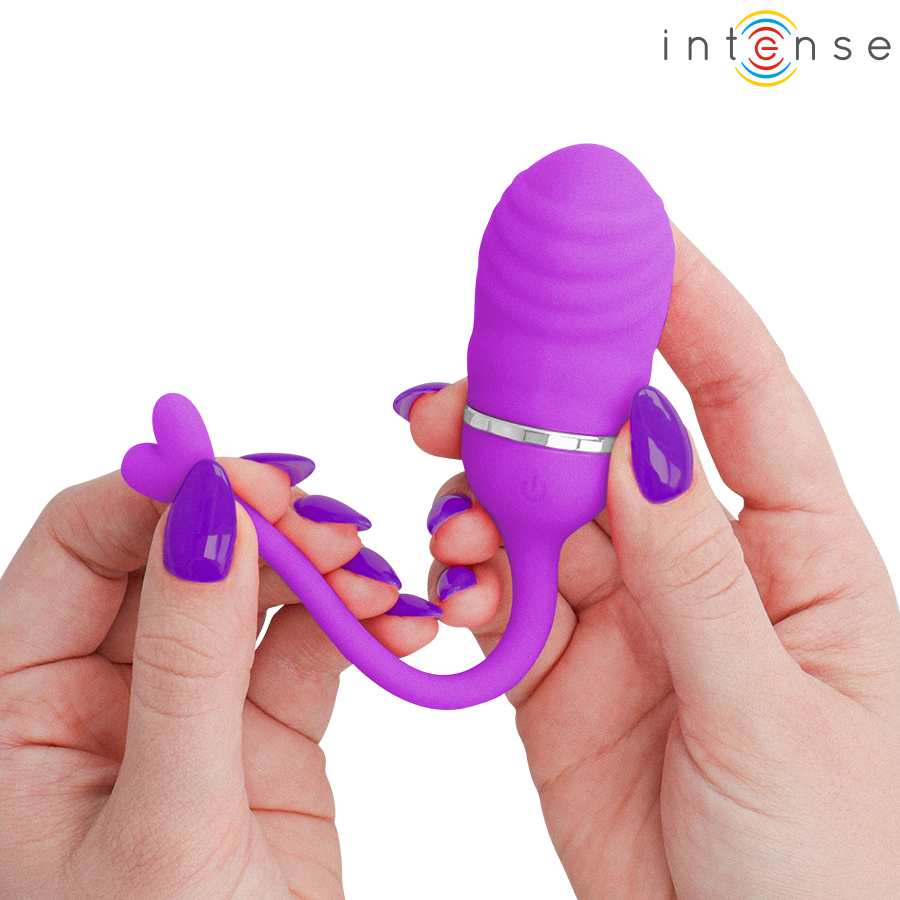 Œuf vibrant Sookie Intense violet tenu entre deux mains